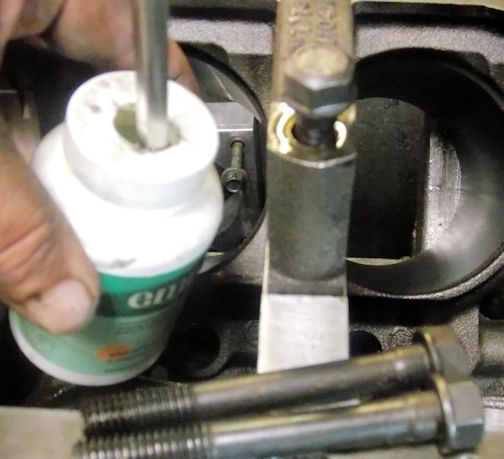 Spill-proof engine assembly lube dispenser